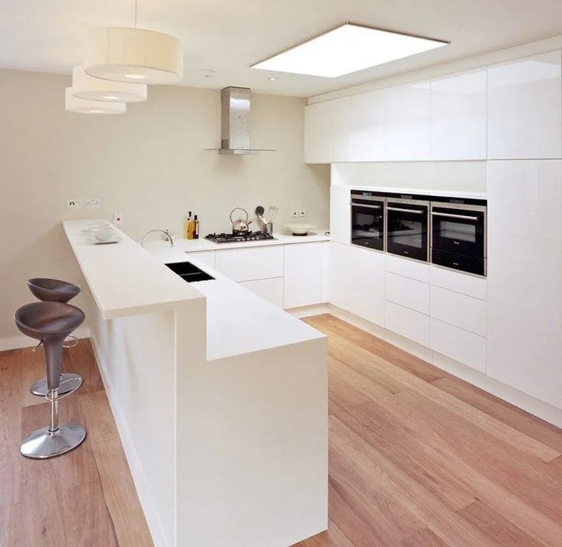 U-shaped modular kitchen by Creations Woodkraft